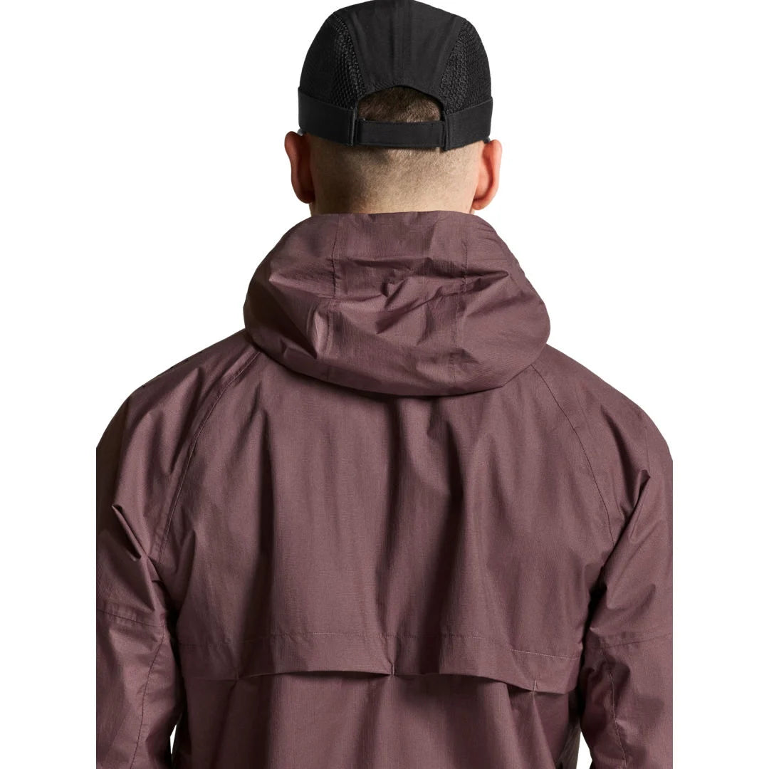 Rearr photo of man in a purple jacket 