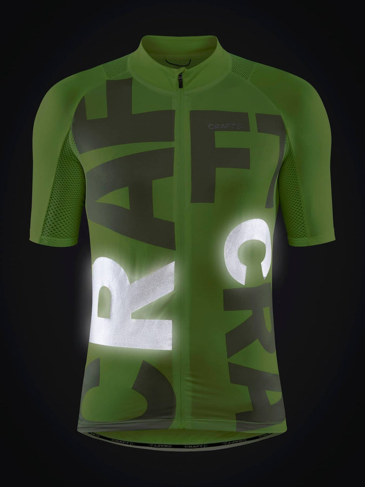 Green cycling jersey with reflective text on a black background