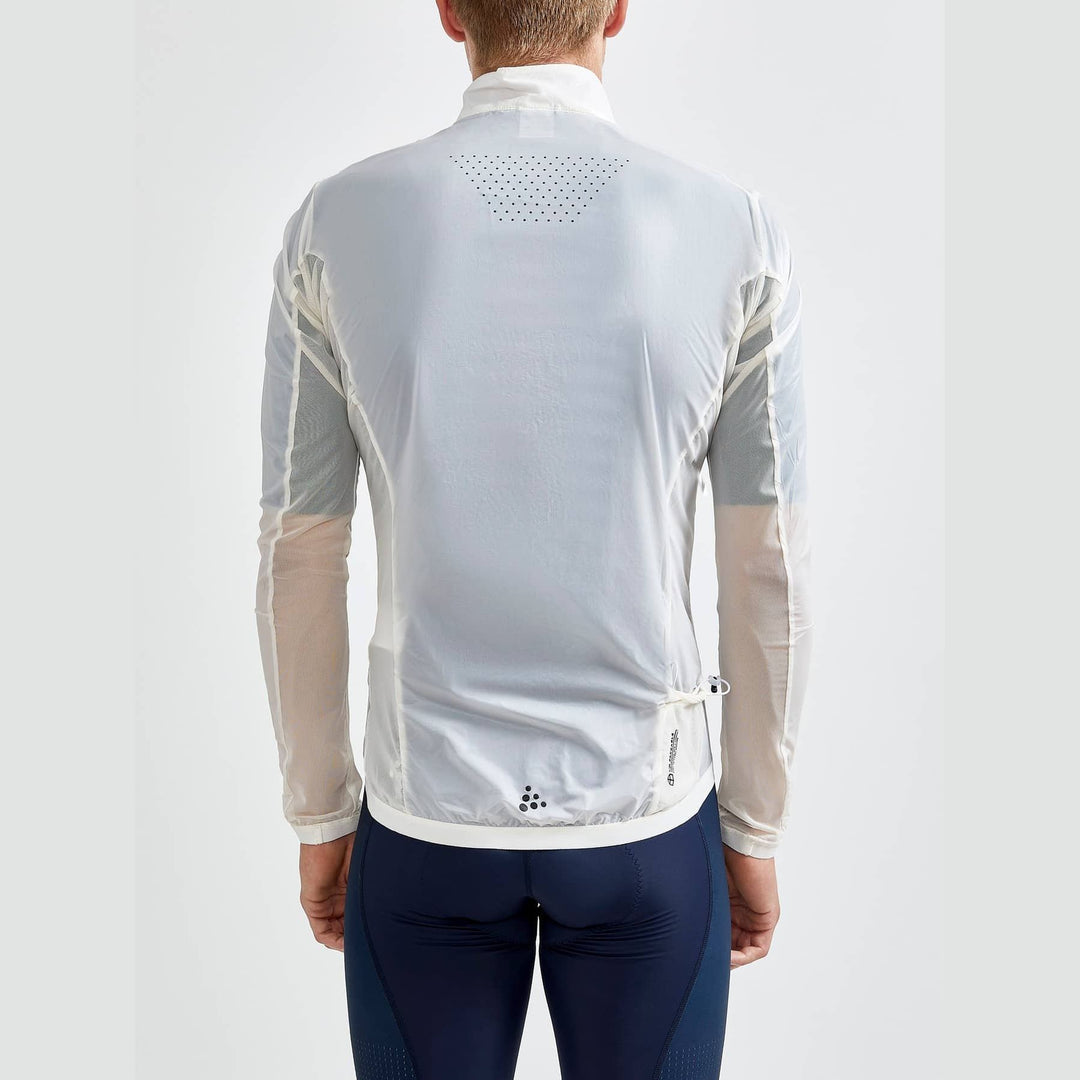 Person wearing a transparent cycling jacket with visible branding on a white background