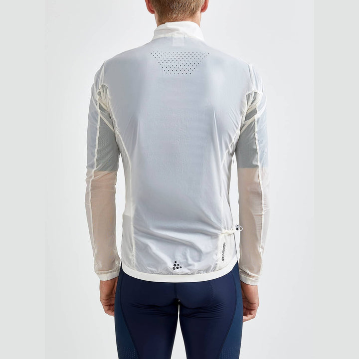 Person wearing a transparent cycling jacket with visible branding on a white background