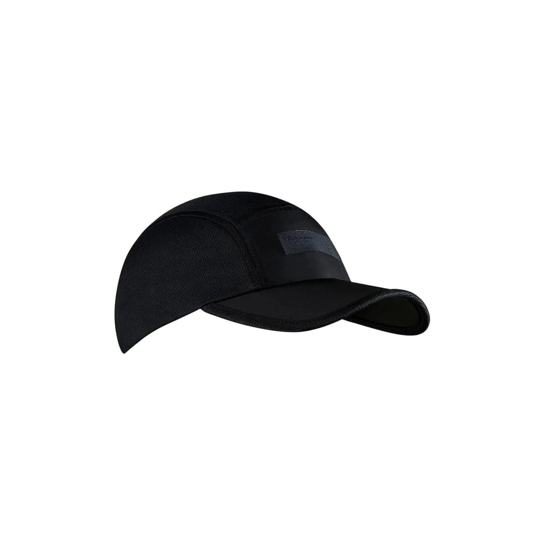 Black baseball cap on a beige background