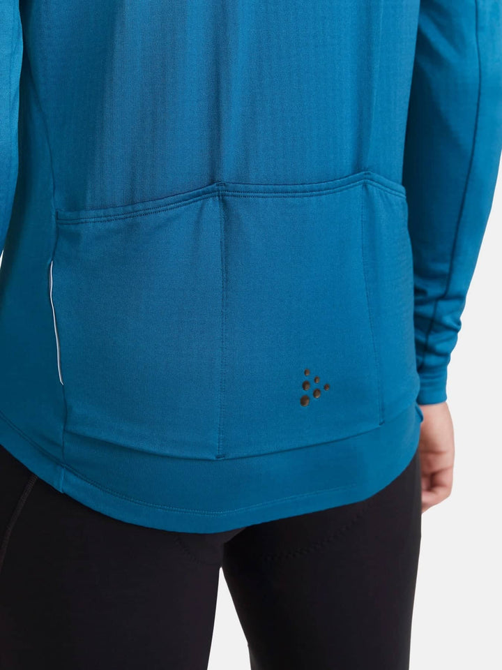 Blue athletic jacket with a brand logo on a white background