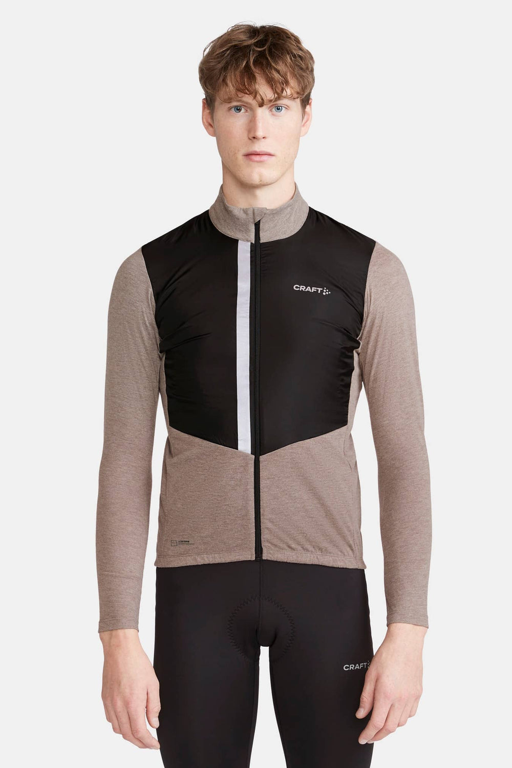 Person wearing a black and brown cycling outfit with 'Craft' branding on a white background