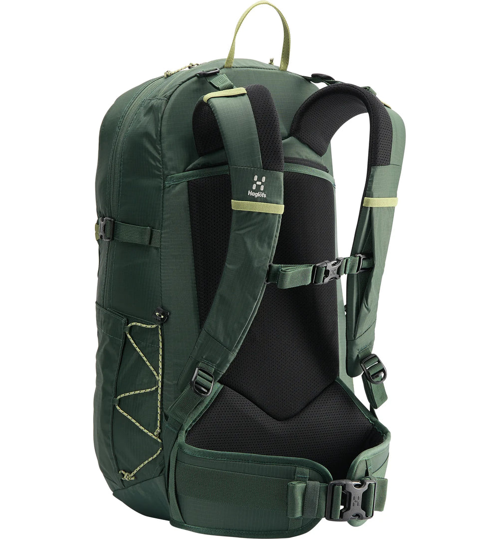 Green backpack with black interior on a white background