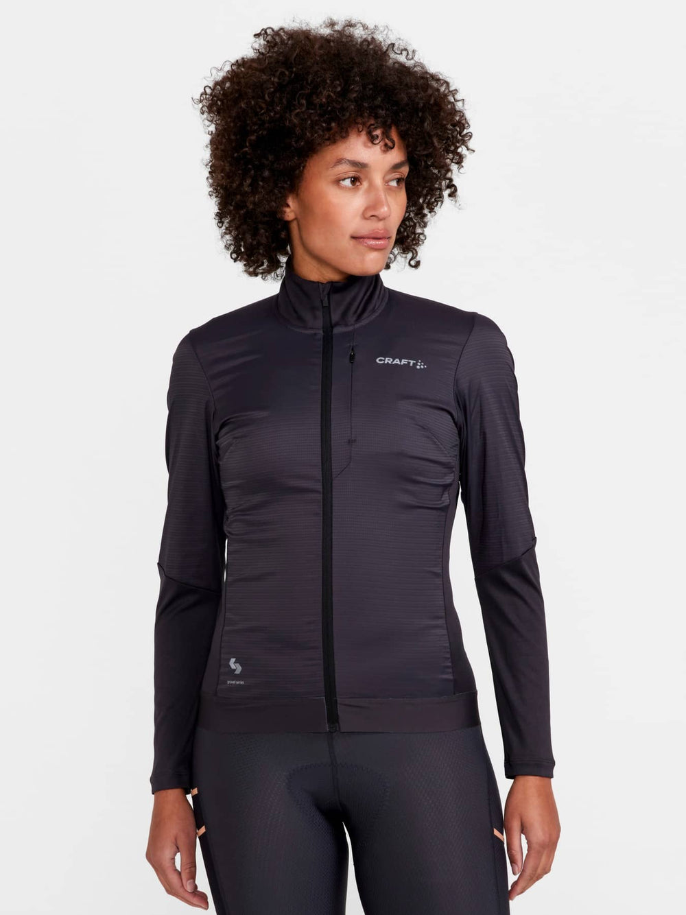 Woman wearing a black jacket with Craft logo on a white background