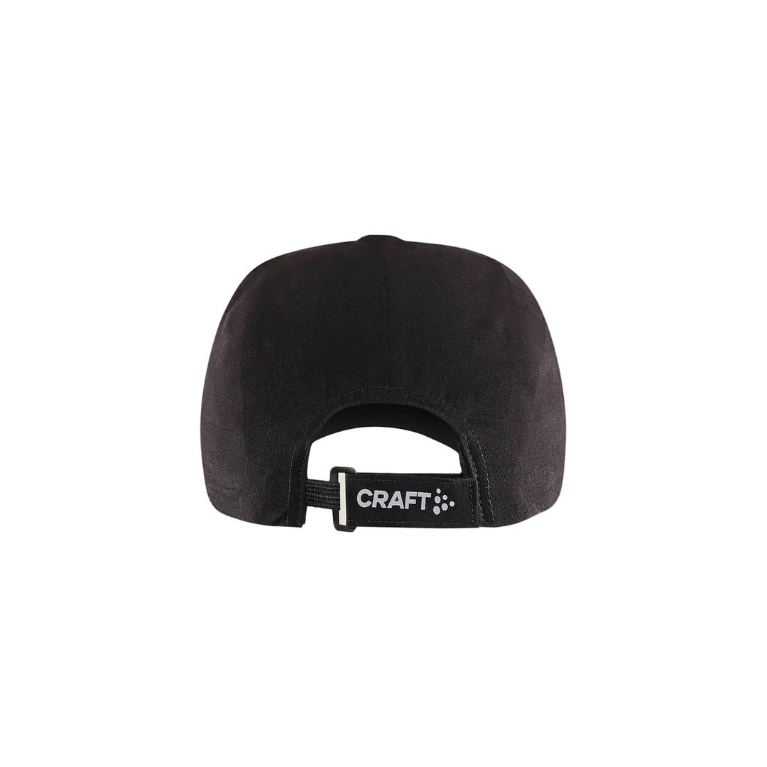 Black cap with a brand logo on a beige background