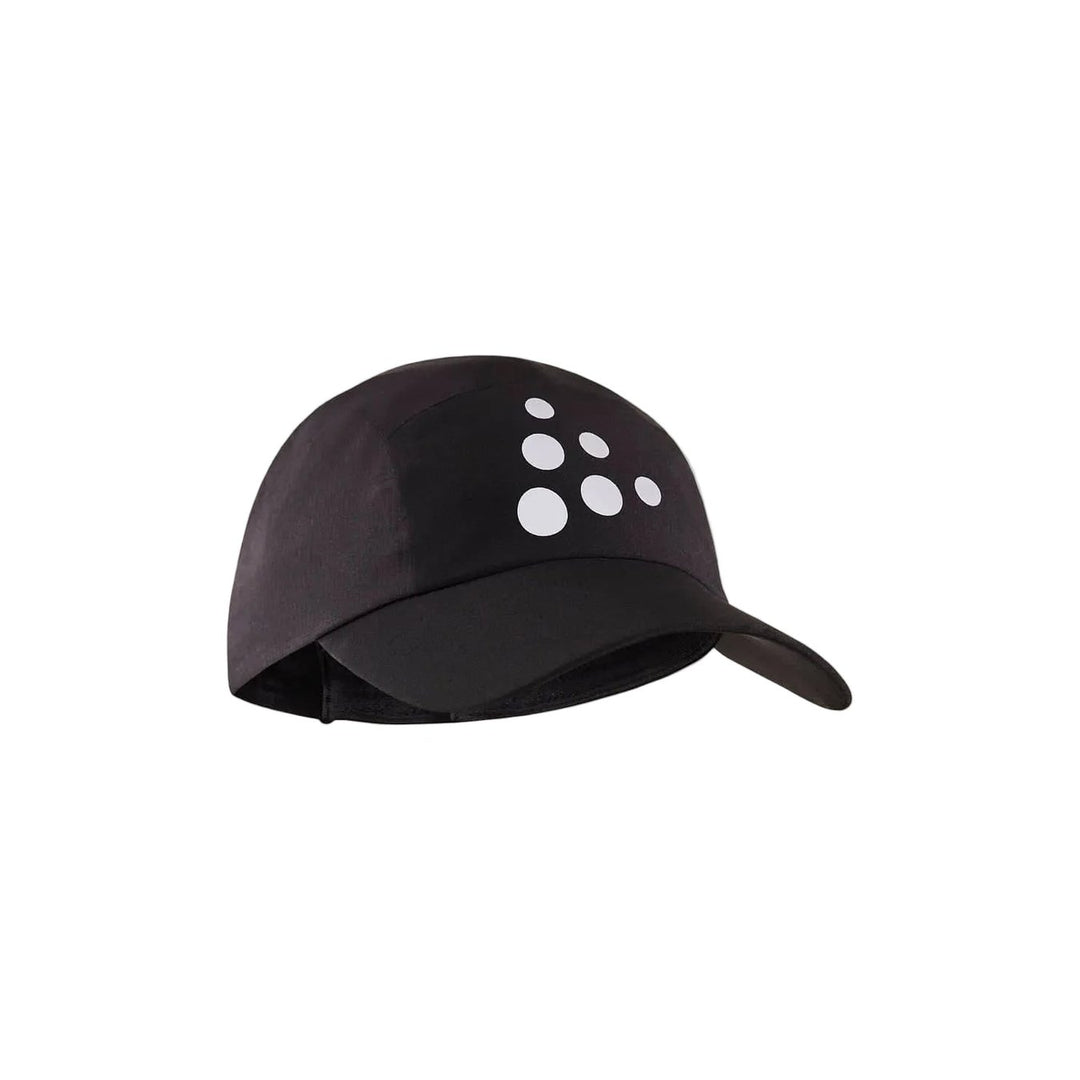 Black cap with white logo on a beige background