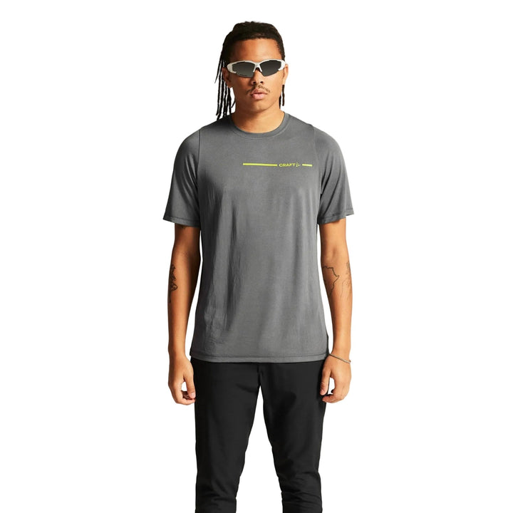 Male model wearing Craft Core Essence Bi-Blend Tee in Leaf, versatile t-shirt designed for everyday comfort and active lifestyles.