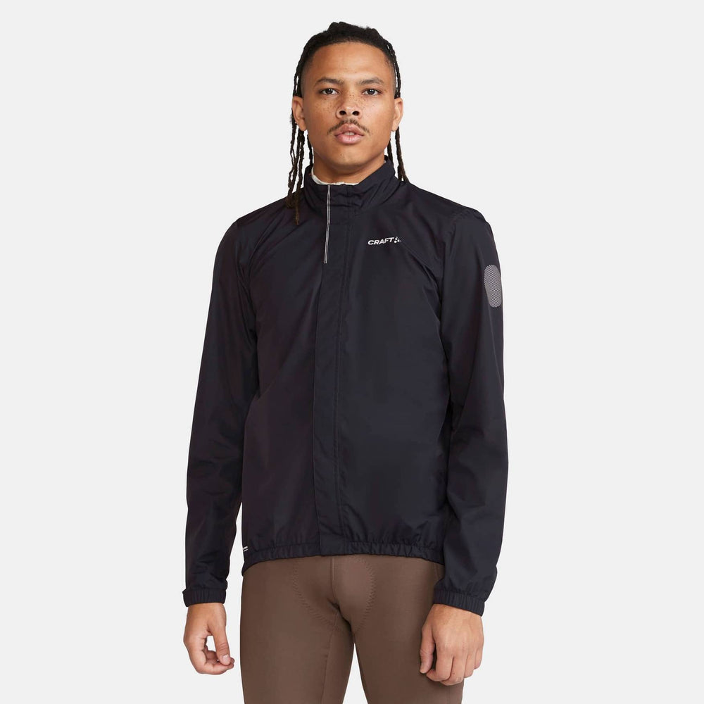 Person wearing a black jacket with 'Craft' branding on a white background
