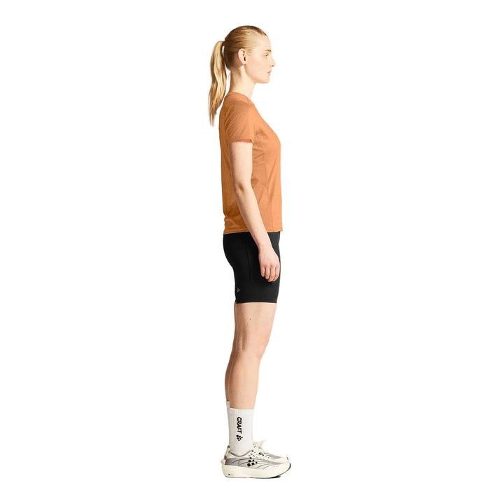 Side profile of female athlete wearing Craft ADV Essence SS Tee 2 Women&