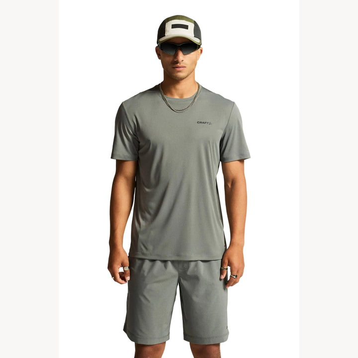 Male athlete wearing Craft Core Essence SS Tee 2 in Leaf, lightweight training shirt designed for running, fitness, and everyday workouts.