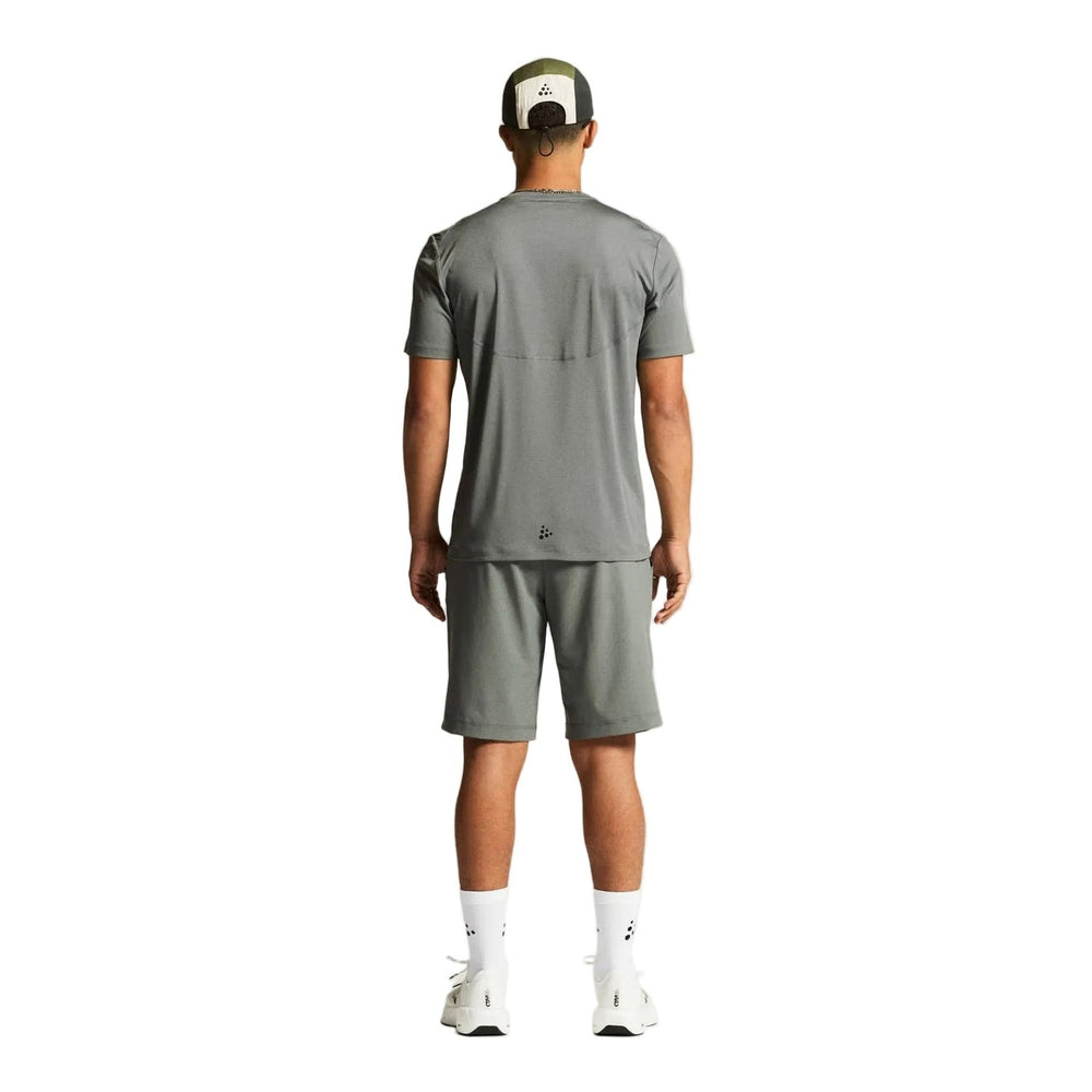 Back view of Craft Core Essence SS Tee 2 Men's showcasing breathable moisture-wicking construction and comfortable regular fit.