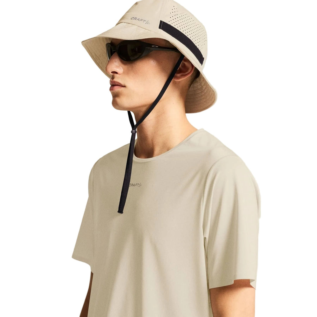 Side profile of male athlete wearing Craft Pro Trail SS Tee 2 Men&