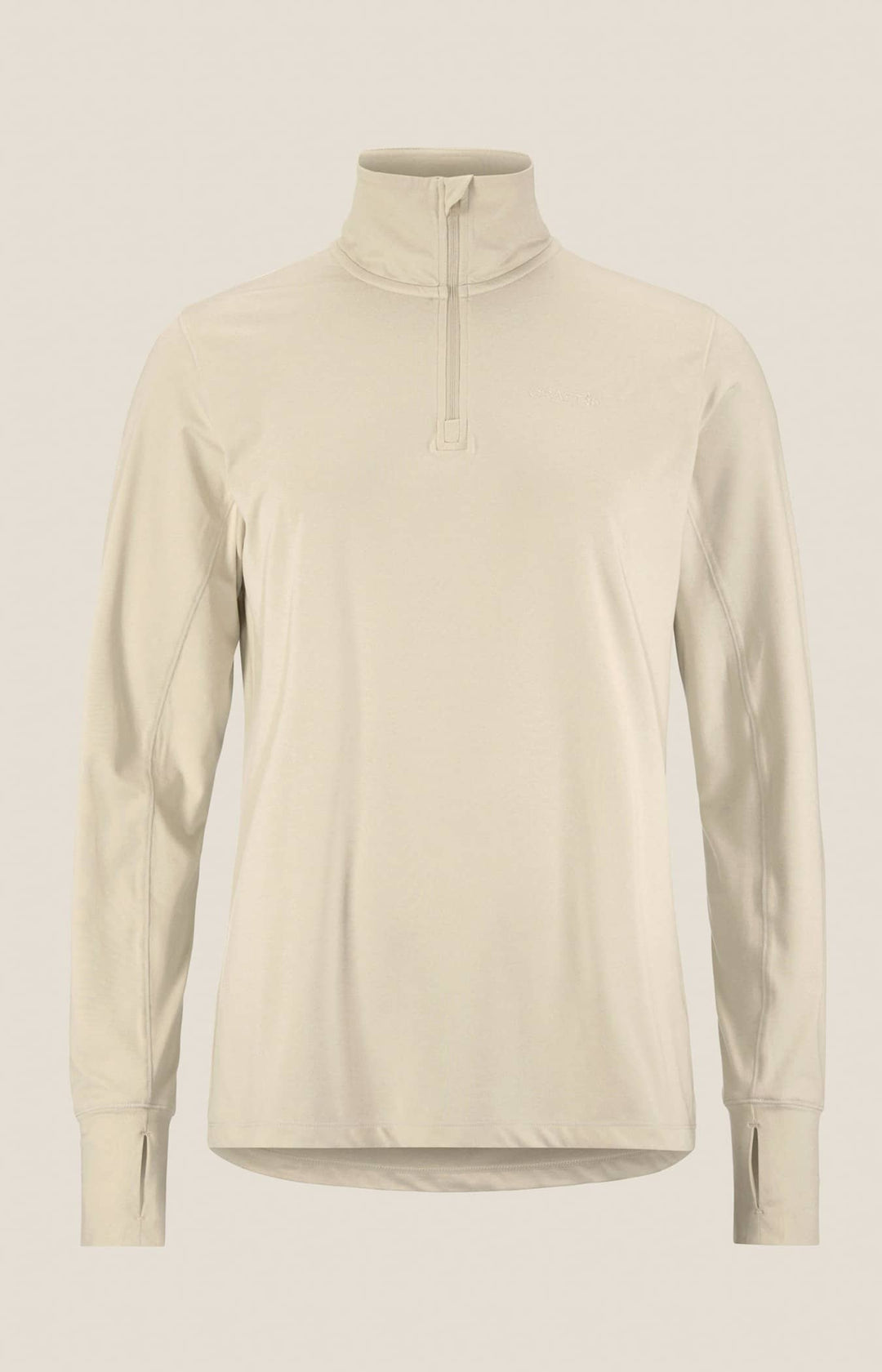 Beige long-sleeve shirt with a quarter zip on a light beige background