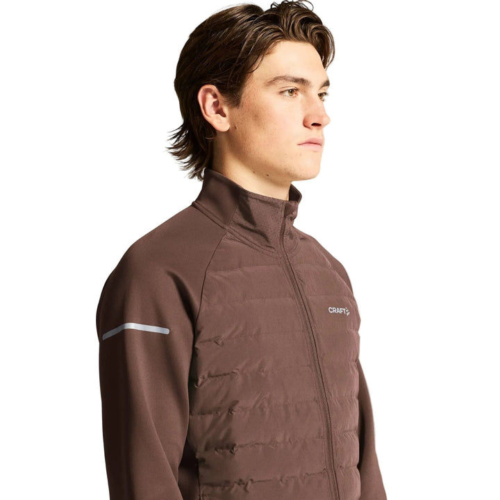 Side profile of male runner wearing Craft SubZ Jacket 4 Men&