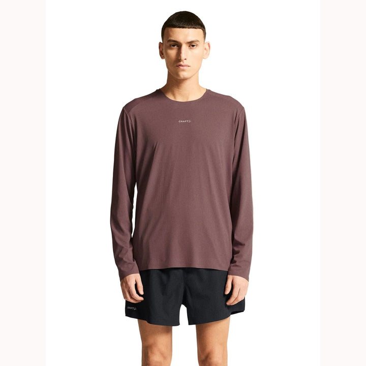 Male runner wearing Craft Hypervent Longsleeve in Flint, lightweight performance shirt designed for running and high-intensity training.