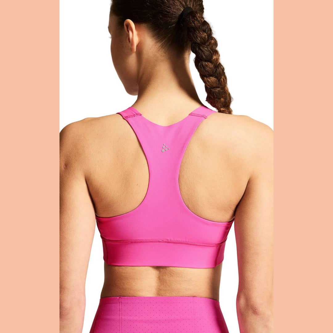 Close-up view of the integrated storage pocket on the Craft Hypervent Pocket Sport Top Women&