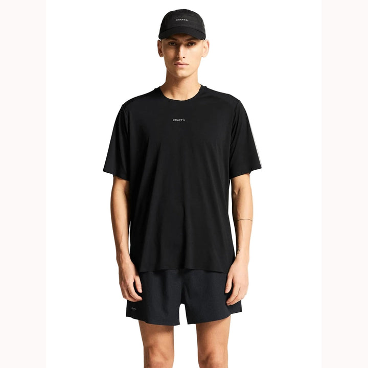 Male runner wearing Craft Hypervent Tee in Black, lightweight performance shirt designed for running and high-intensity training.