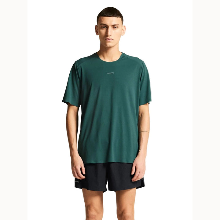 Male runner wearing Craft Hypervent Tee in Peridot, lightweight performance shirt designed for running and high-intensity training.