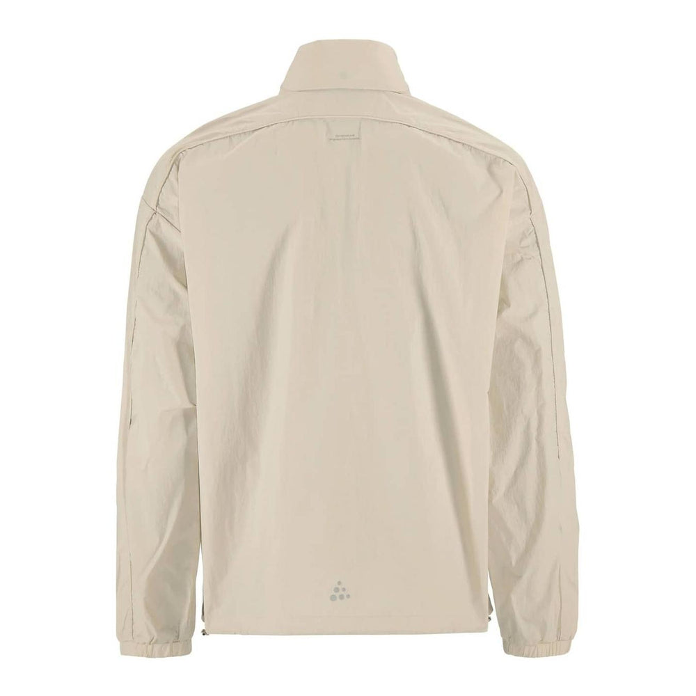 Back view of Craft Hypervent Oversized Wind Jacket Men's showcasing breathable construction and relaxed performance styling.