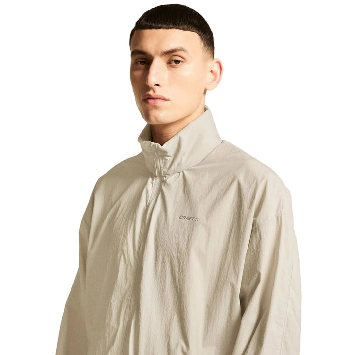 Male runner wearing Craft Hypervent Oversized Wind Jacket Men&