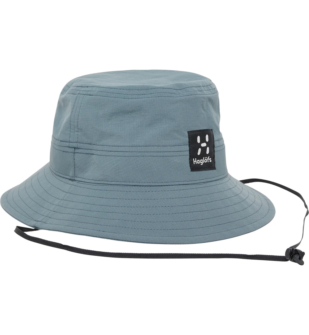 Blue bucket hat with a brand logo on a white background