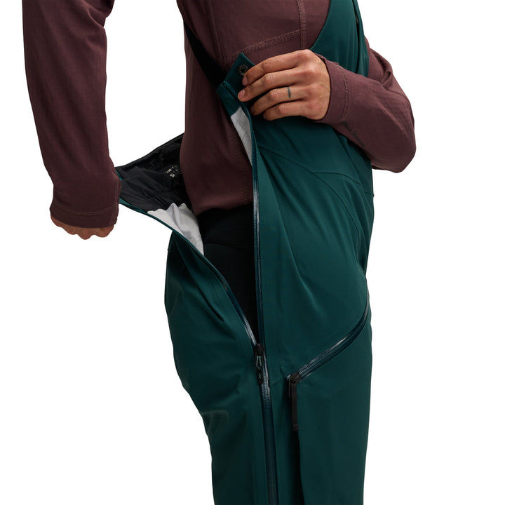 Black Diamond Women’s Factor Bibs with GORE-TEX waterproof fabric, body-mapped insulation, full-length vents, and women’s articulated fit. side profile