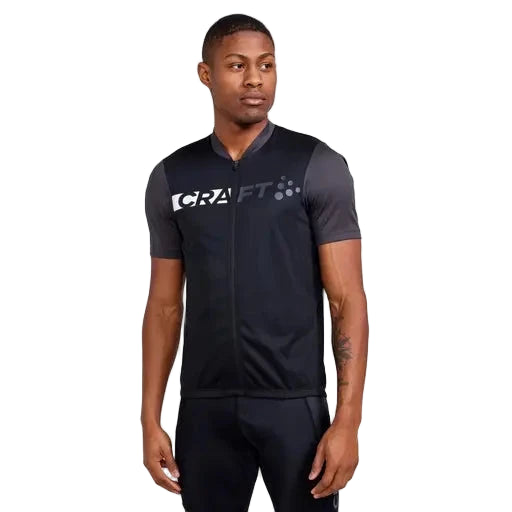 Black men’s Endur cycling jersey with subtle branding, moisture-control fabric and ergonomic ride fit.