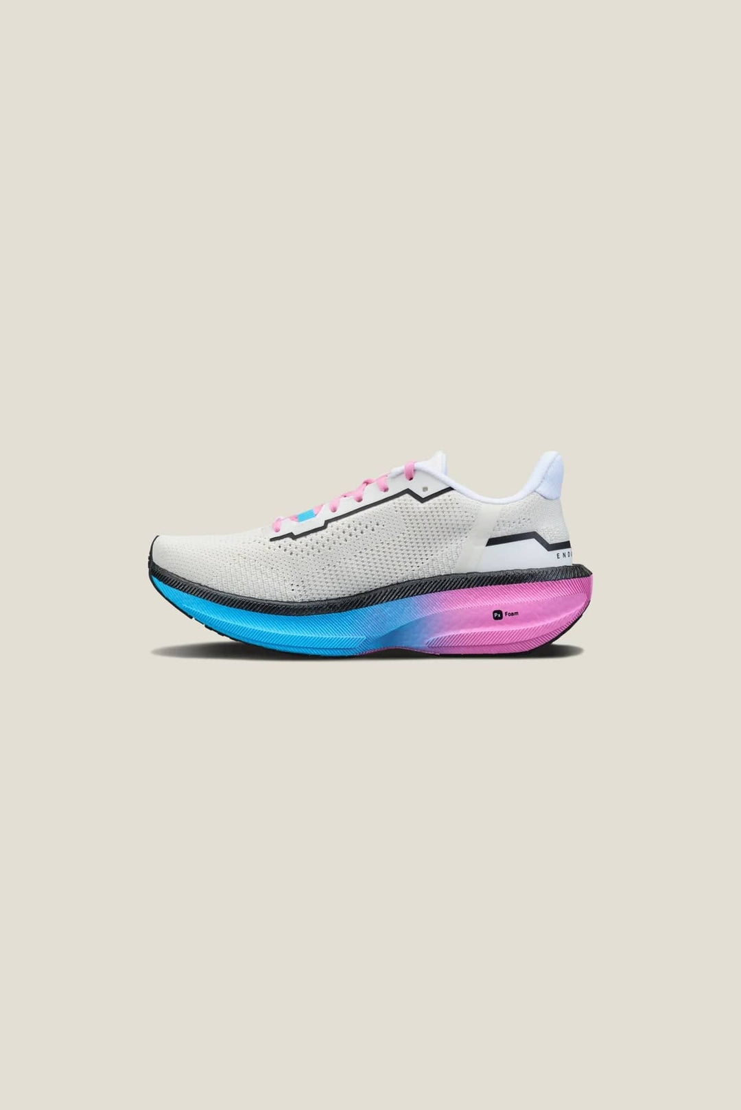 White running shoe with colorful sole on a beige background