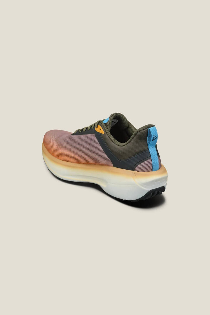 Multicolored athletic shoe on a beige background