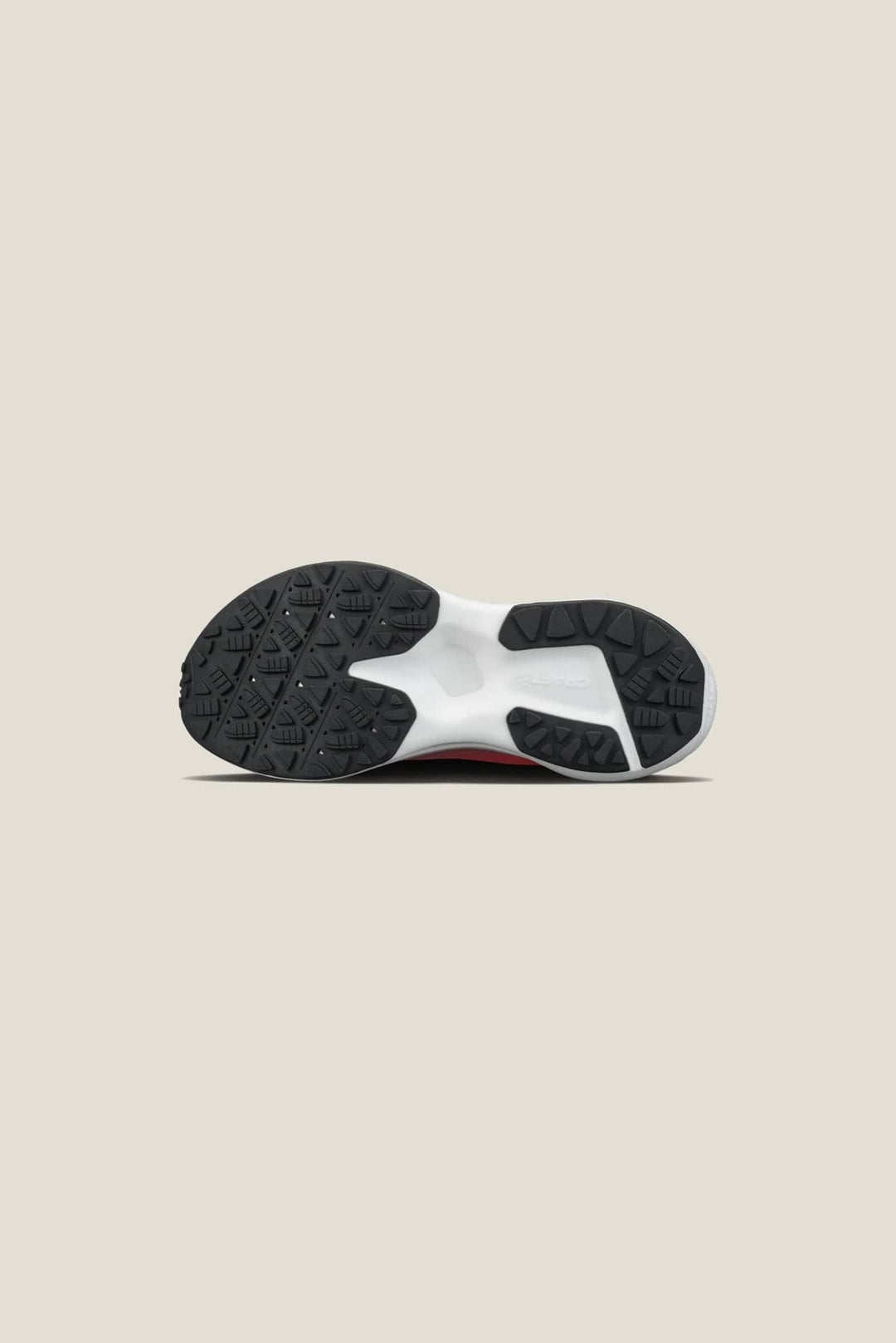 Black sandal with white floral embellishments on a white background