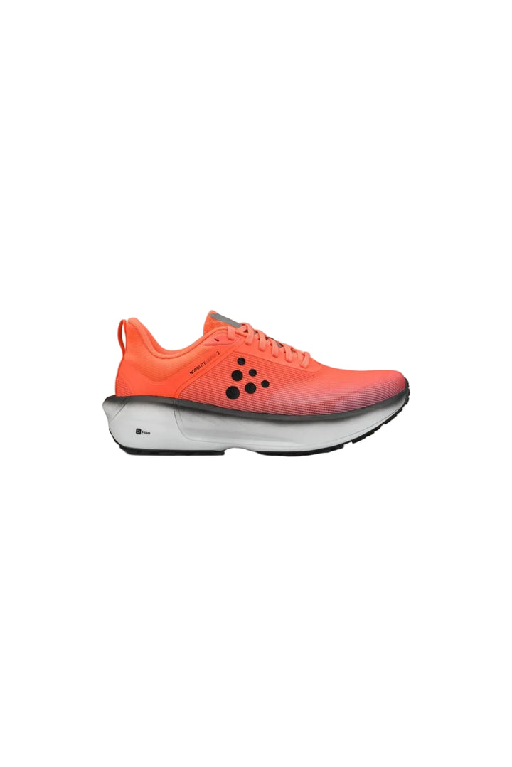 Orange running shoe on a beige background