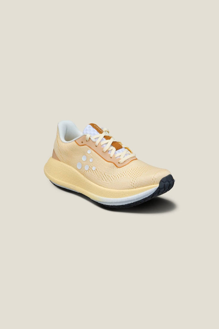 Beige running shoe on a beige background