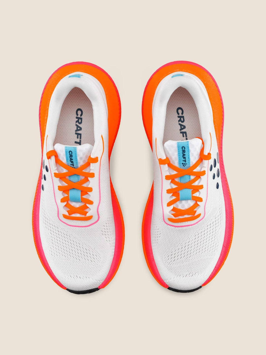 White running shoes with orange accents and &