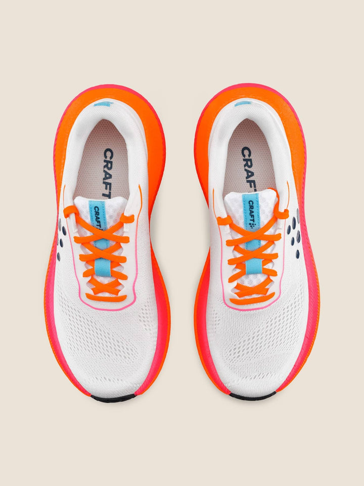 White running shoes with orange accents and &