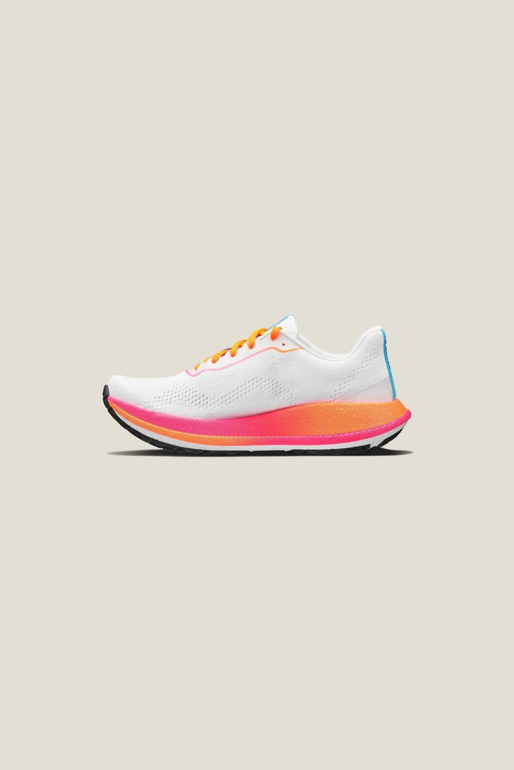 White running shoe with orange and pink accents on a beige background
