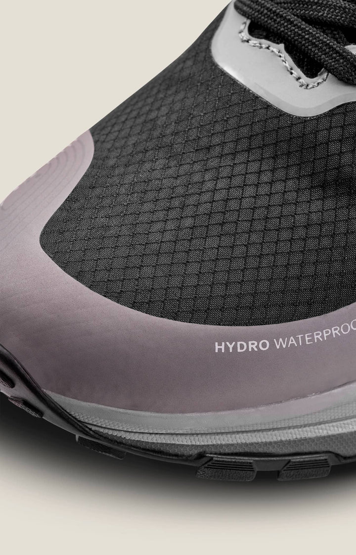 Close-up of a gray and black shoe with &