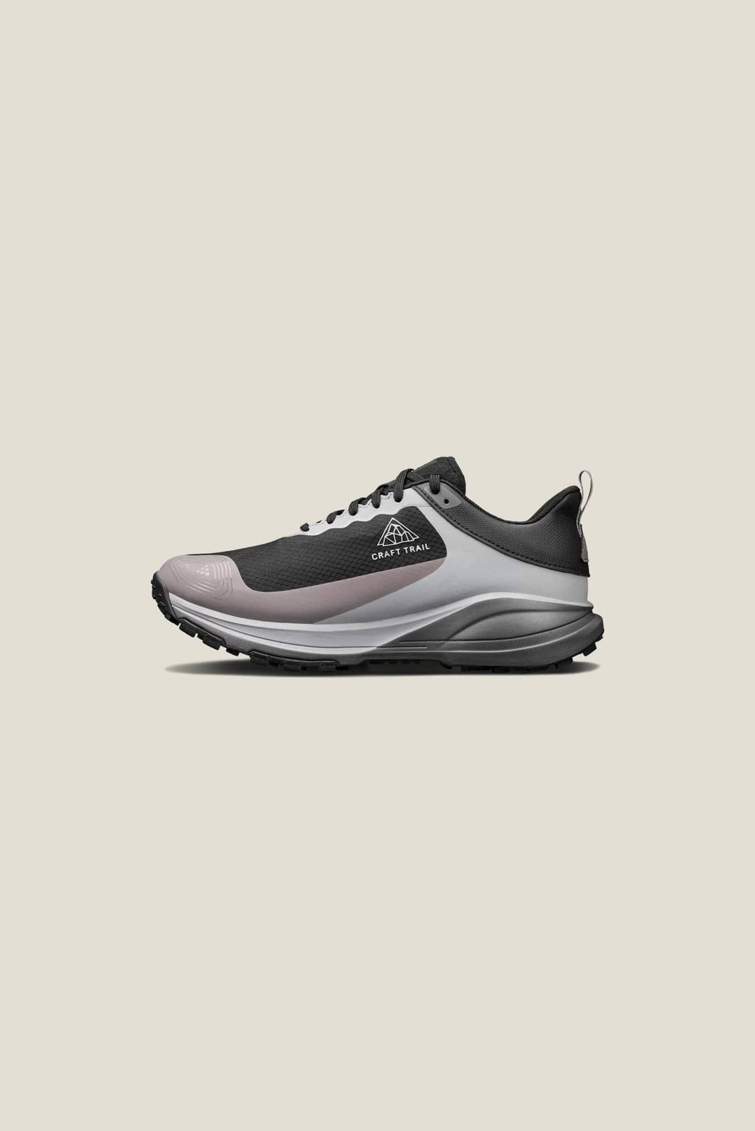 Gray and black athletic shoe on a beige background