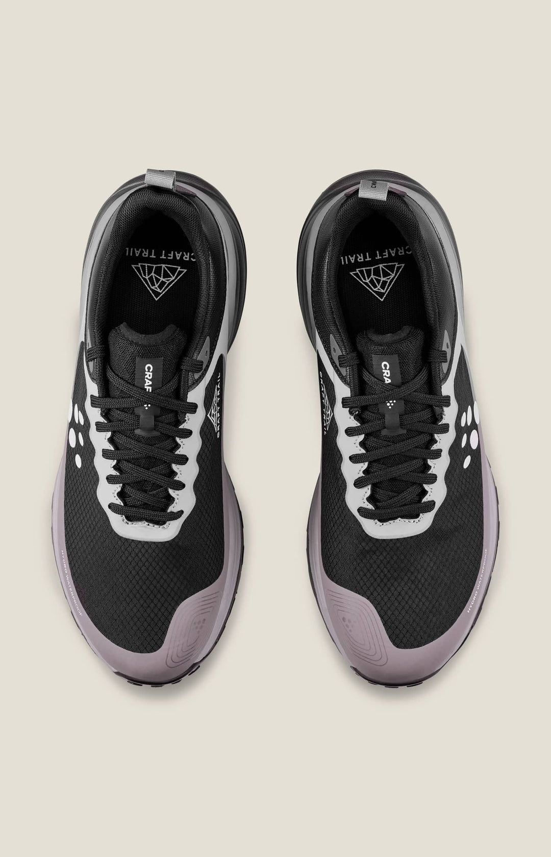 Black and gray sneakers on a beige background