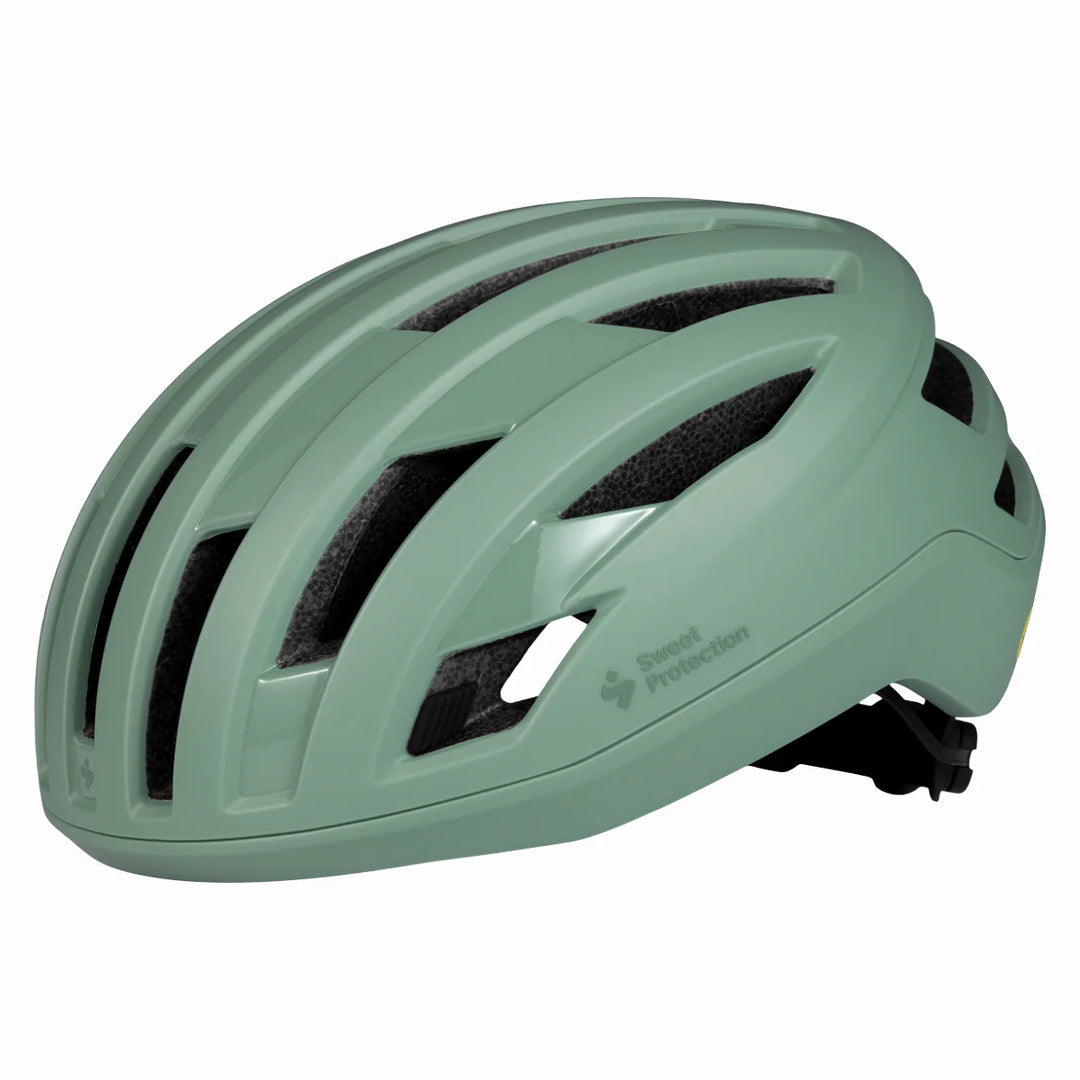 Green helmet with 'Sweet Protection' branding on a white background