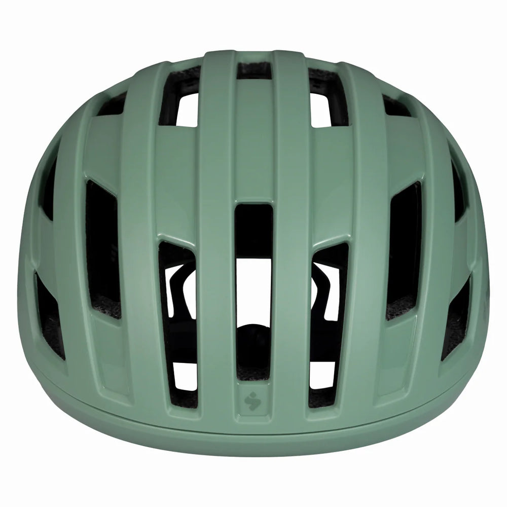Green helmet with ventilation holes on a white background