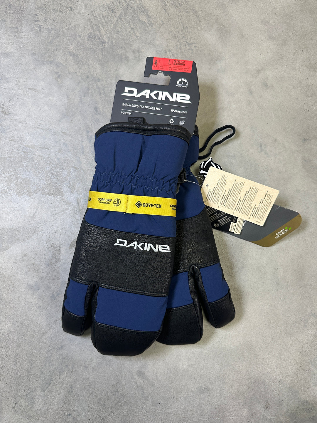 Dakine Baron GORE-TEX Trigger Mitts with waterproof membrane, leather palm, synthetic insulation, and trigger mitten design.