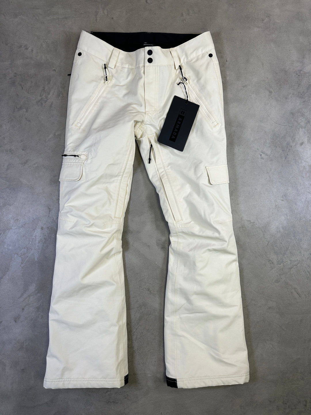 Cream Armada Mula 2L women’s ski and snowboard pants with waterproof breathable fabric and snow gaiters.
