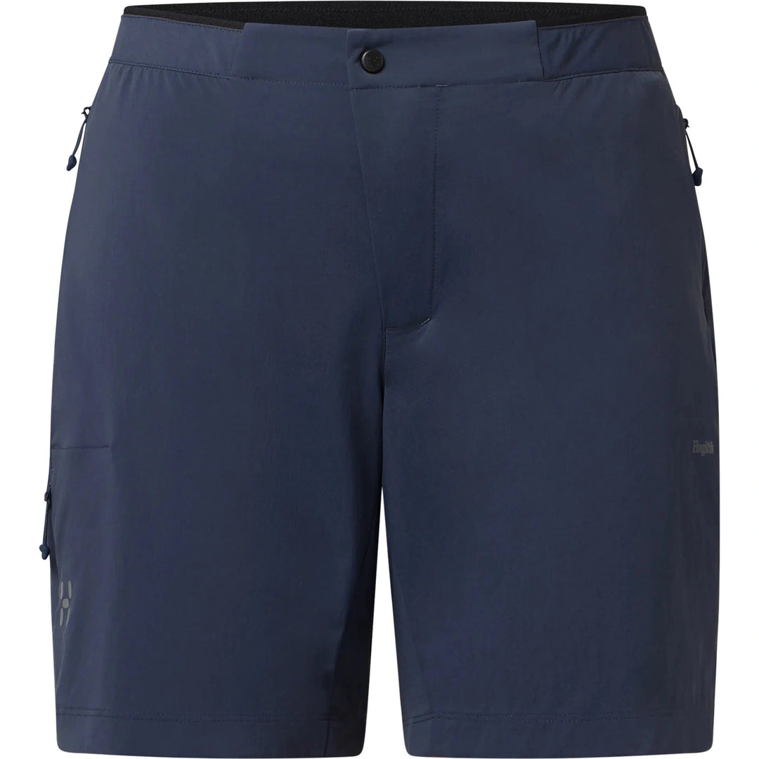 Navy blue shorts with zippers on a white background