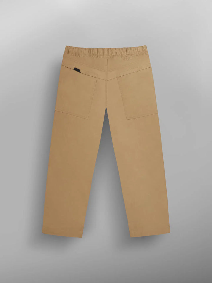 Beige pants on a gray background
