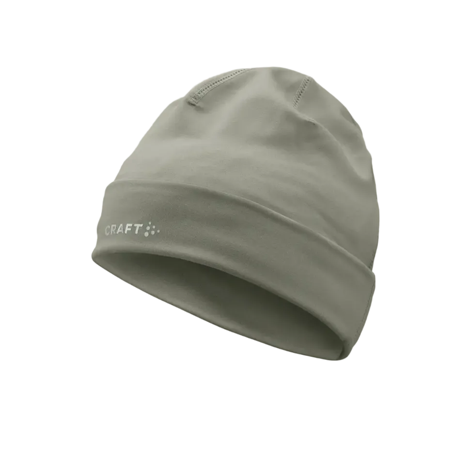Green beanie hat with a brand logo on a beige background