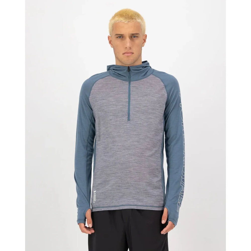 Mons Royale Temple Merino Long Sleeve Hood for men. Lightweight, breathable merino base layer with hood for warmth, comfort, and outdoor performance. front male view 