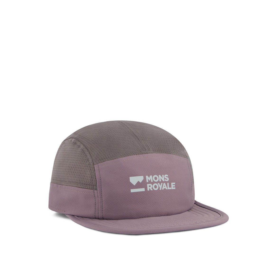 Two-tone cap with 'Mons Royale' logo on a white background