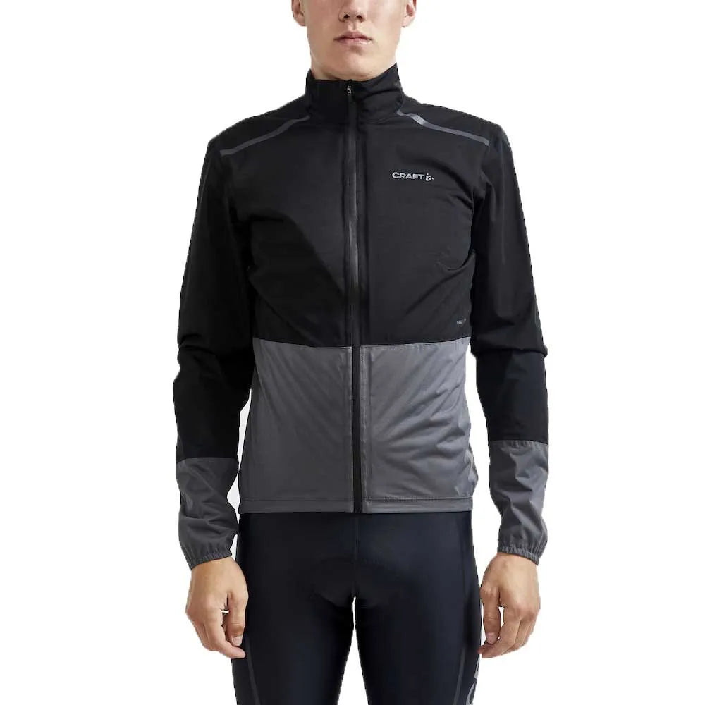 Person wearing a black and gray jacket with 'Craft' branding on a white background
